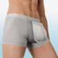 Gray boxer briefs worn by a person on a light blue background