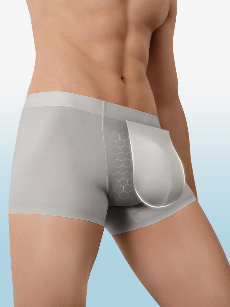 Gray boxer briefs worn by a person on a light blue background