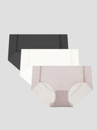 Three-pack of NuCloud Original Bikini low-rise briefs in black, white, and beige with seamless raw-cut edges and breathable cotton gusset.