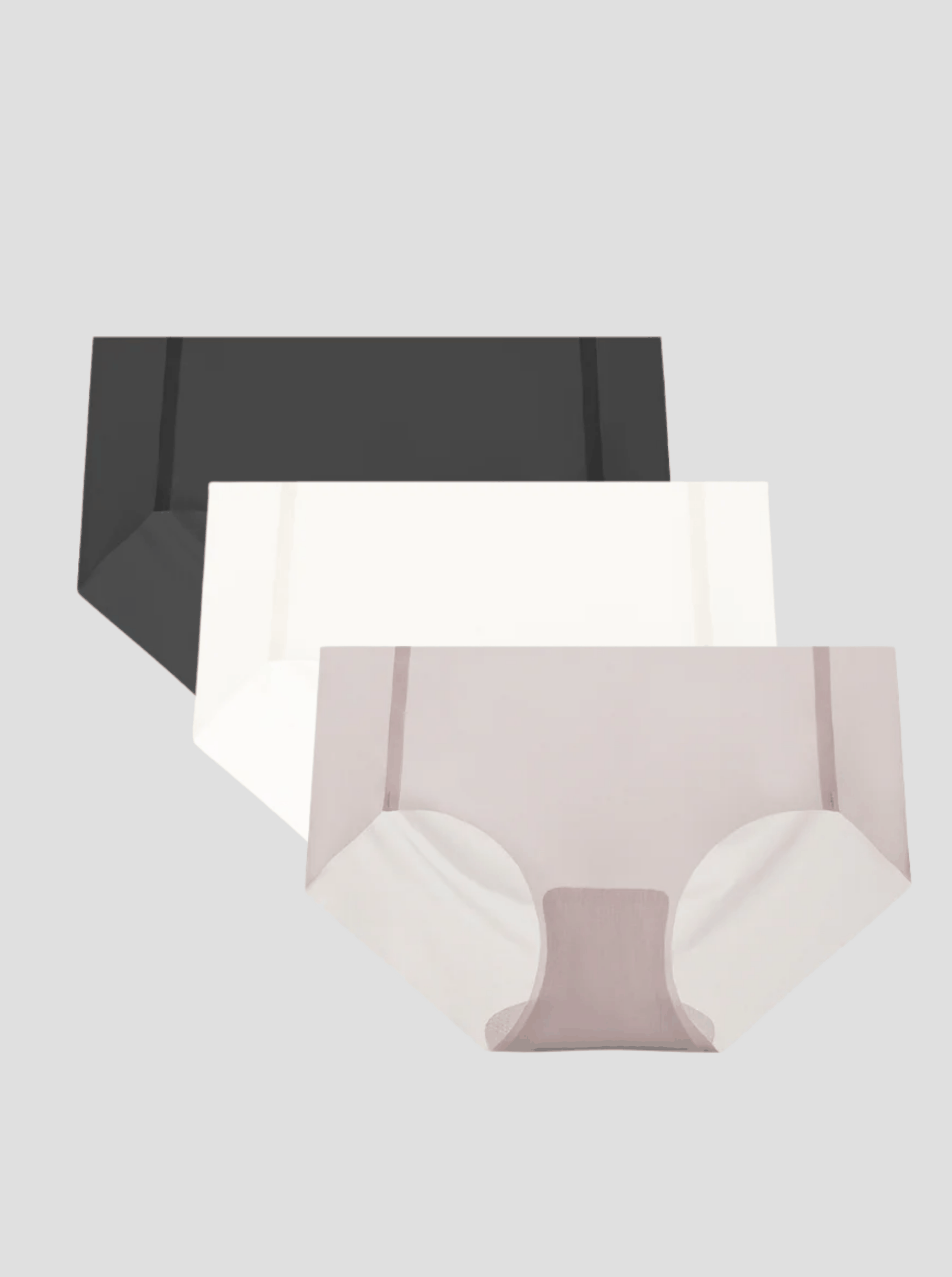 Three-pack of NuCloud Original Bikini low-rise briefs in black, white, and beige with seamless raw-cut edges and breathable cotton gusset.