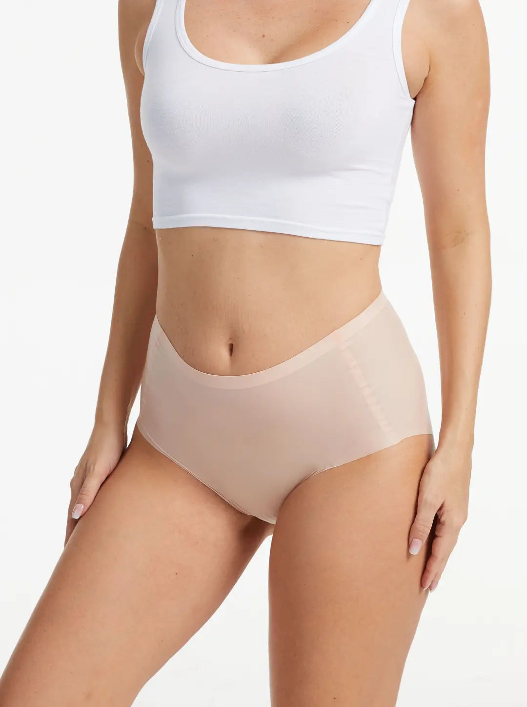 Woman wearing nude NuCloud Original High-Rise seamless high-rise briefs with smooth, breathable fabric and full coverage fit