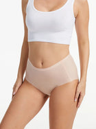 Woman wearing nude NuCloud Original High-Rise seamless high-rise briefs with smooth, breathable fabric and full coverage fit