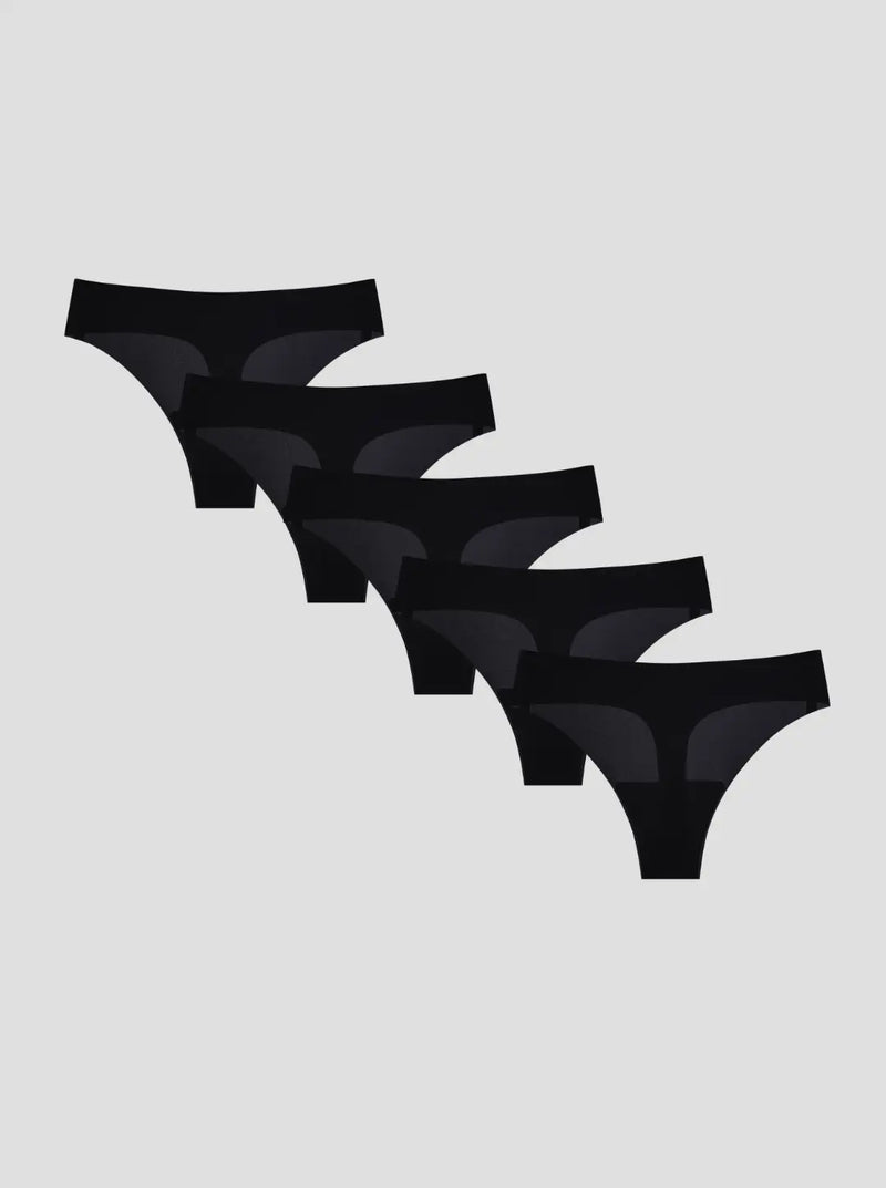 Set of five black thongs on a light gray background