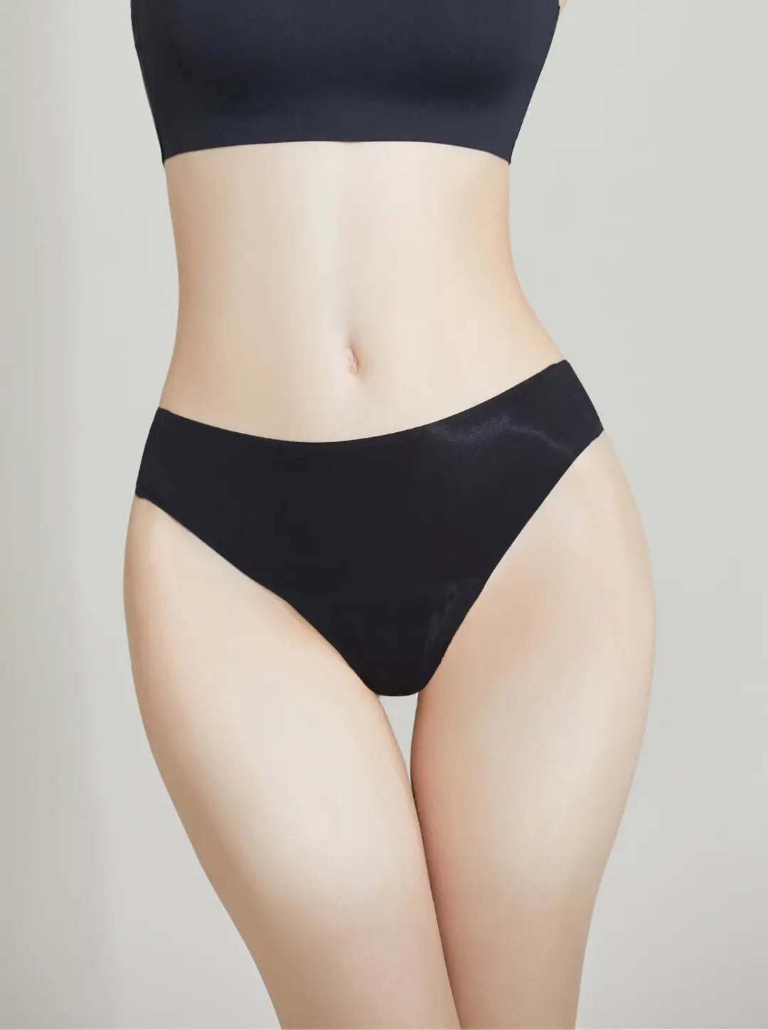 Black NuCloud Original Thong set on a neutral background