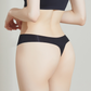 Person wearing a NuCloud Original Thong Black set on a plain background