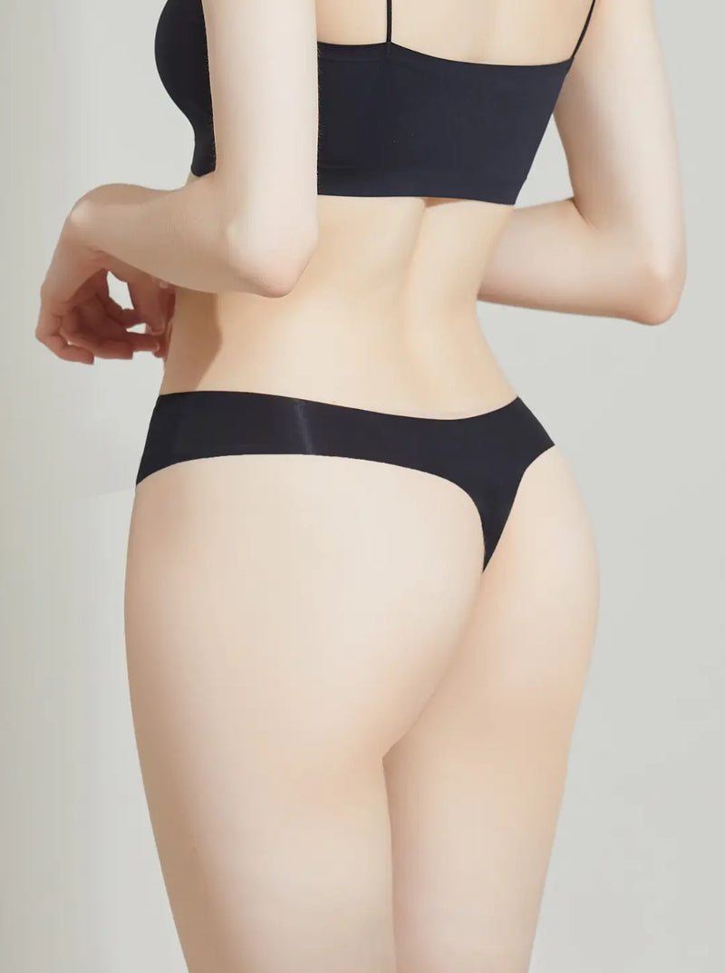 Person wearing a NuCloud Original Thong Black set on a plain background