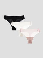 Three pairs of NuCloud Original Thong in black, white, and pink on a light gray background.