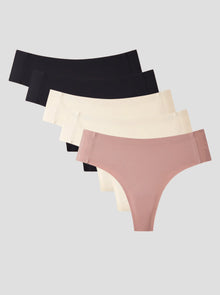 NuShield Anti Camel Thong 5-pack with seamless edges and antibacterial gusset in black, beige, and pink colors