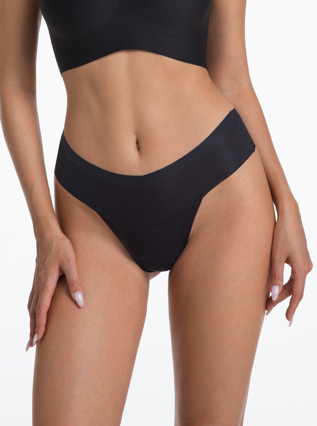 NuShield Thong Light seamless black thong with anti-camel toe protection and breathable fabric for everyday comfort