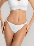 woman wearing white NuSoft String Bikini with high-cut legs and shiny elastic waistband