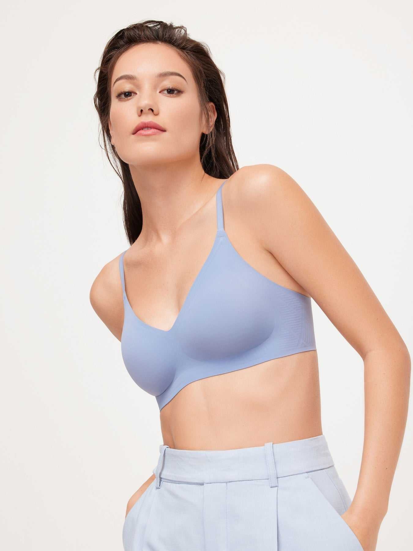 Wireless Soft Stay-Put Bra in soft blue with scoop neckline and adjustable straps on model